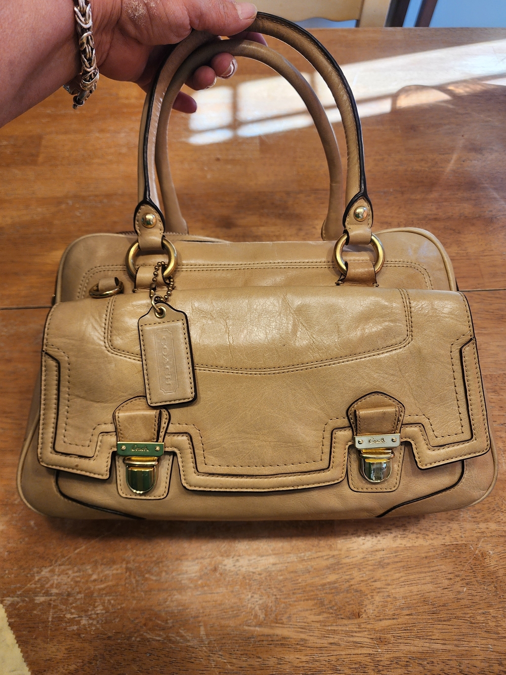 2011 Coach Poppy Push Lock Satchel features a beige leather exterior